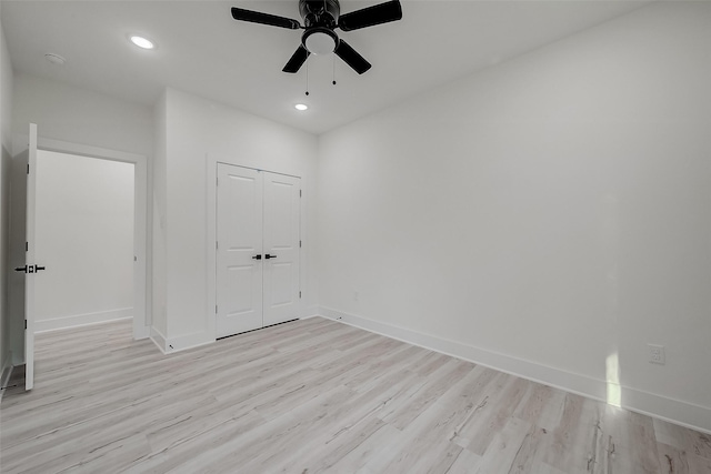 unfurnished room with light wood-type flooring and ceiling fan