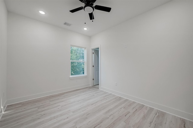 unfurnished room featuring ceiling fan and light hardwood / wood-style flooring