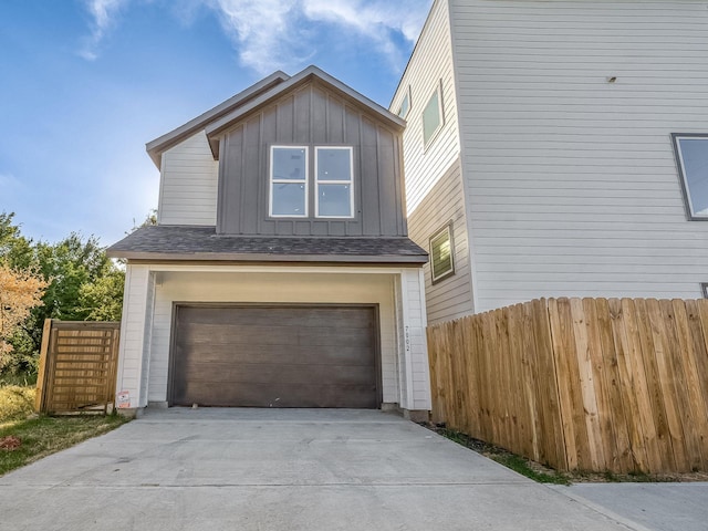 view of side of home with a garage