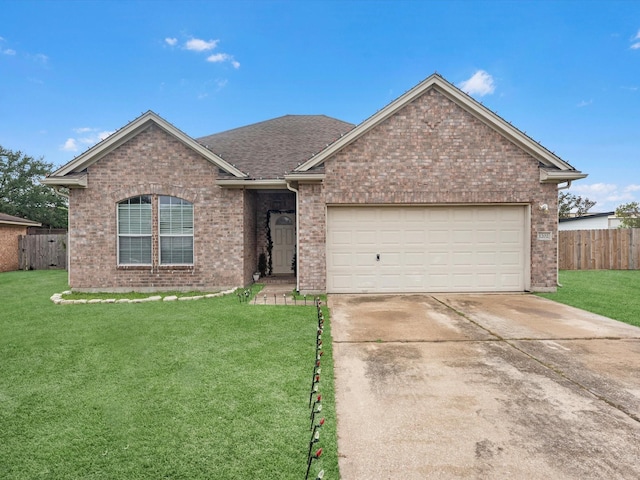 view of front facade with a garage and a front yard