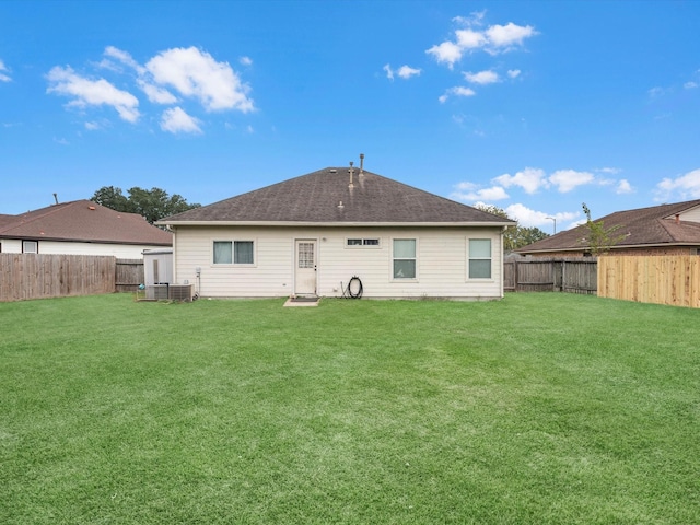 back of house with a yard