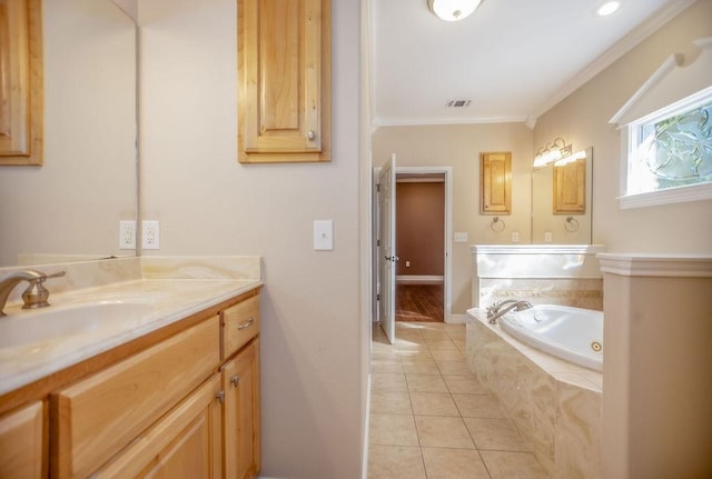 bathroom featuring tile patterned flooring, vanity, ornamental molding, and tiled bath