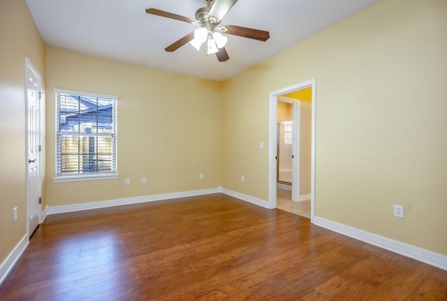 spare room with ceiling fan and wood-type flooring