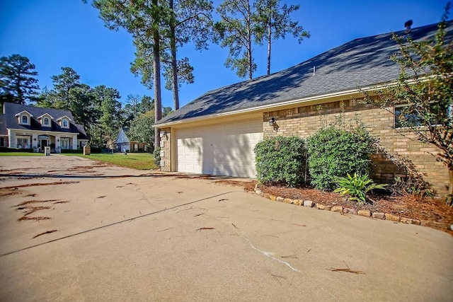 view of side of property featuring a garage