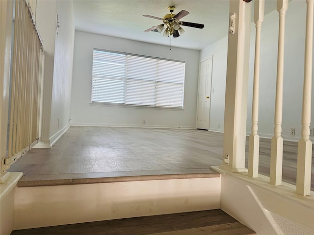 unfurnished room with hardwood / wood-style flooring and ceiling fan