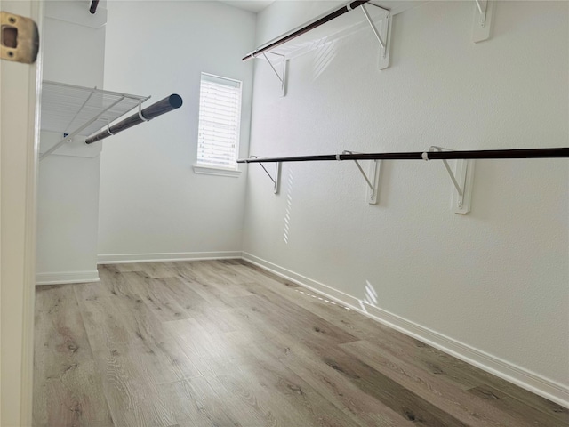 walk in closet featuring light hardwood / wood-style floors