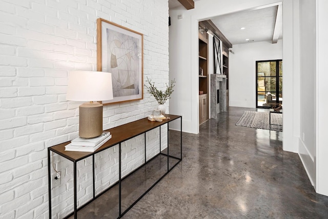7010 Bowie Ct, Montgomery, TX 77316 - corridor featuring finished concrete flooring and baseboards