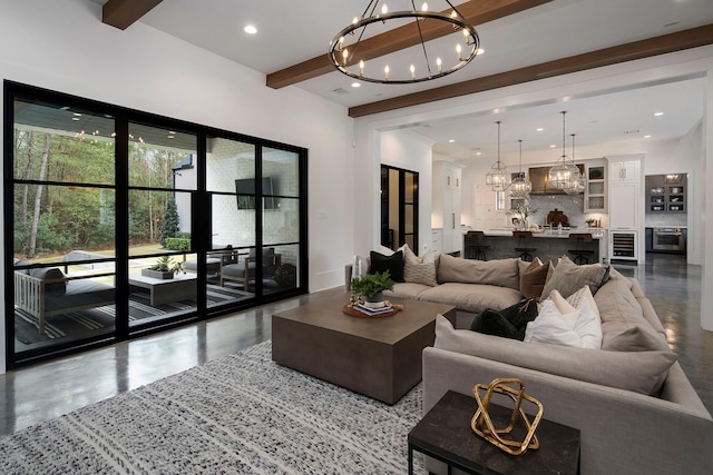 living room featuring beamed ceiling and a notable chandelier