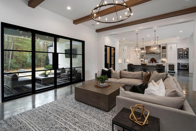 7010 Bowie Ct, Montgomery, TX 77316 - living room with a chandelier, wine cooler, beam ceiling, and recessed lighting