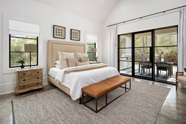7010 Bowie Ct, Montgomery, TX 77316 - bedroom featuring finished concrete floors, access to outside, and high vaulted ceiling