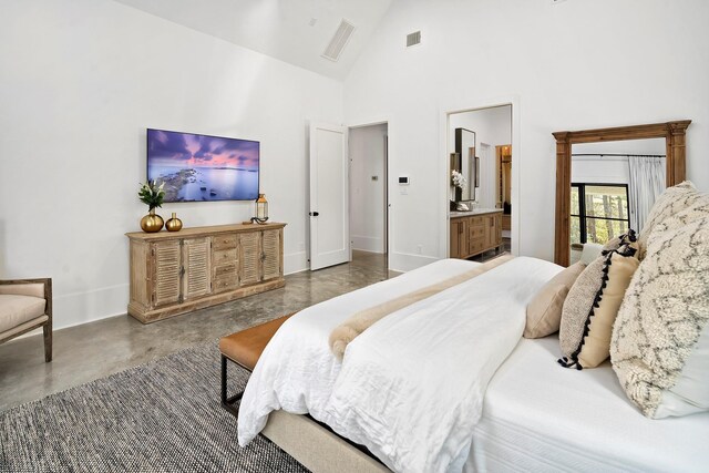 7010 Bowie Ct, Montgomery, TX 77316 - bedroom featuring concrete floors, high vaulted ceiling, and connected bathroom