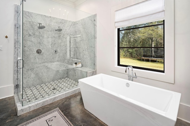 bathroom with concrete floors and separate shower and tub