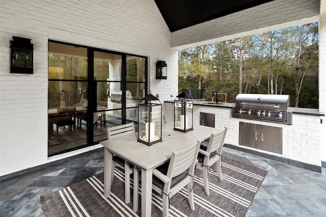 view of patio with grilling area and exterior kitchen