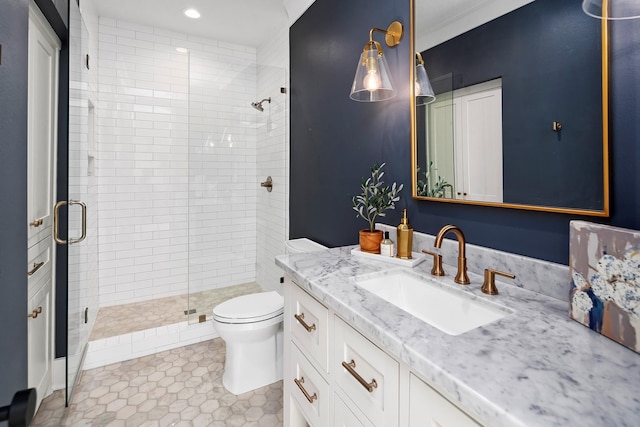 bathroom with vanity, crown molding, tile patterned flooring, toilet, and walk in shower