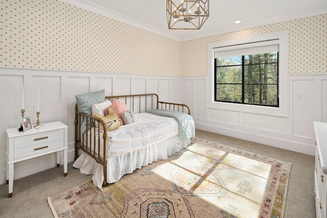 7010 Bowie Ct, Montgomery, TX 77316 - bedroom featuring crown molding, a decorative wall, a chandelier, light colored carpet, and wainscoting