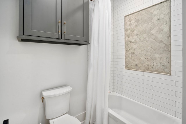 bathroom with shower / bath combo with shower curtain and toilet