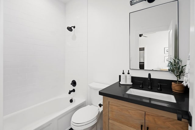 full bathroom featuring vanity, toilet, and tiled shower / bath