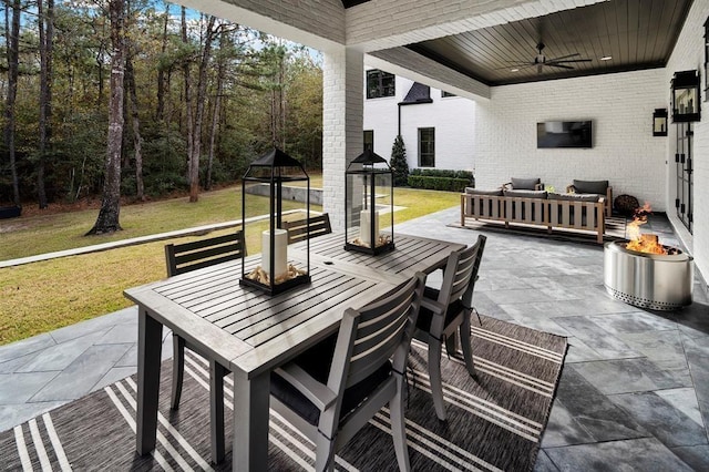 7010 Bowie Ct, Montgomery, TX 77316 - view of patio / terrace featuring outdoor dining area, an outdoor living space with a fire pit, and a ceiling fan