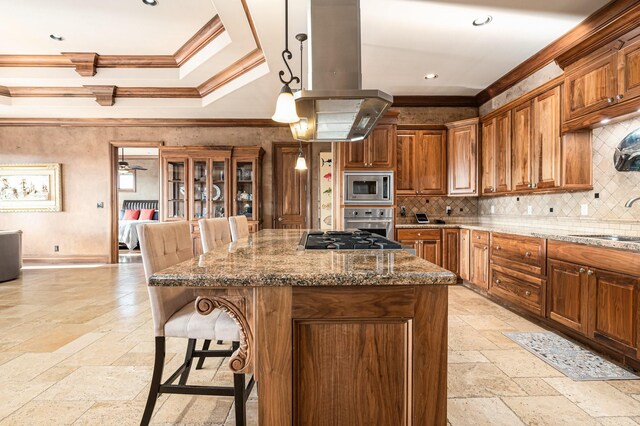 1245 Lagoon Dr, Crystal Beach, TX 77650 - kitchen featuring ornamental molding, stainless steel appliances, island range hood, dark stone countertops, and hanging light fixtures