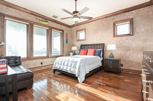 1245 Lagoon Dr, Crystal Beach, TX 77650 - bedroom featuring ceiling fan, wood-type flooring, crown molding, and multiple windows