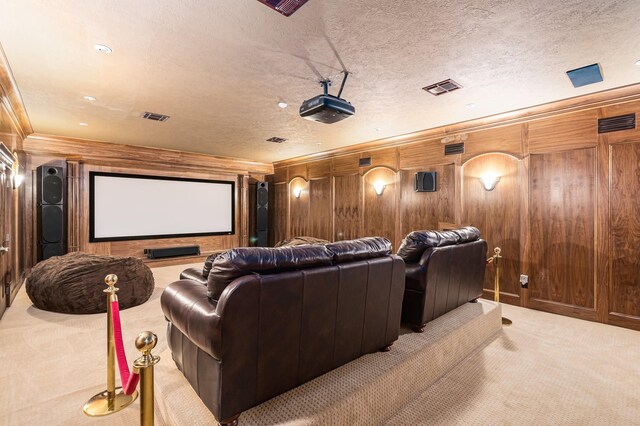 1245 Lagoon Dr, Crystal Beach, TX 77650 - cinema with a textured ceiling, carpet floors, crown molding, and wood walls