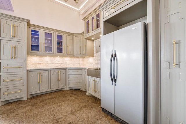 1245 Lagoon Dr, Crystal Beach, TX 77650 - kitchen featuring tasteful backsplash, crown molding, and white fridge