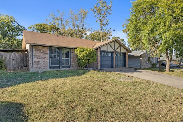 view of front of house with a front yard and a garage