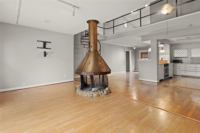 unfurnished living room featuring light hardwood / wood-style floors