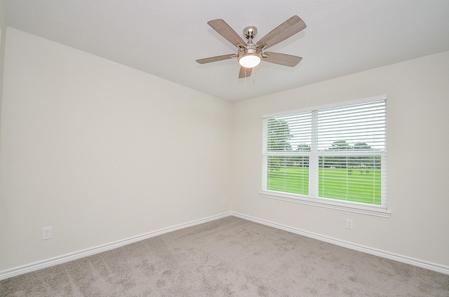 unfurnished room featuring carpet floors and ceiling fan