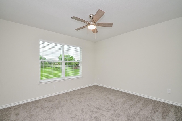 carpeted empty room with ceiling fan