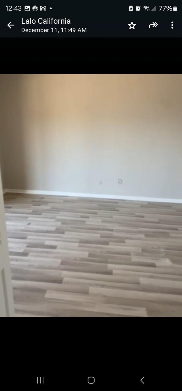 spare room with light wood-type flooring