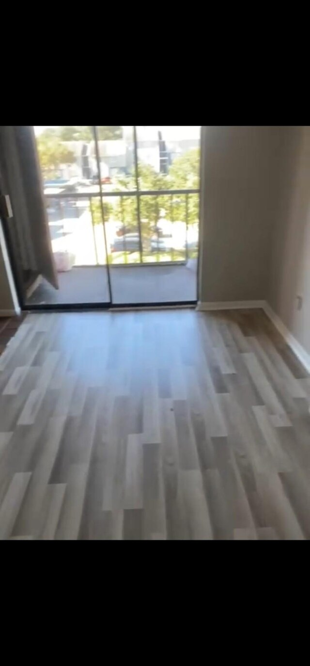 empty room featuring dark hardwood / wood-style floors