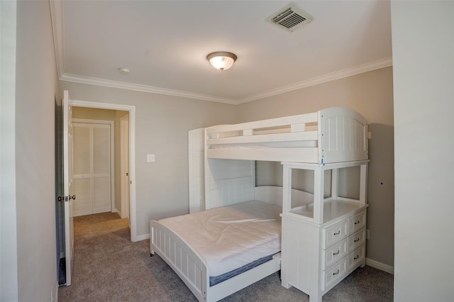 carpeted bedroom featuring crown molding