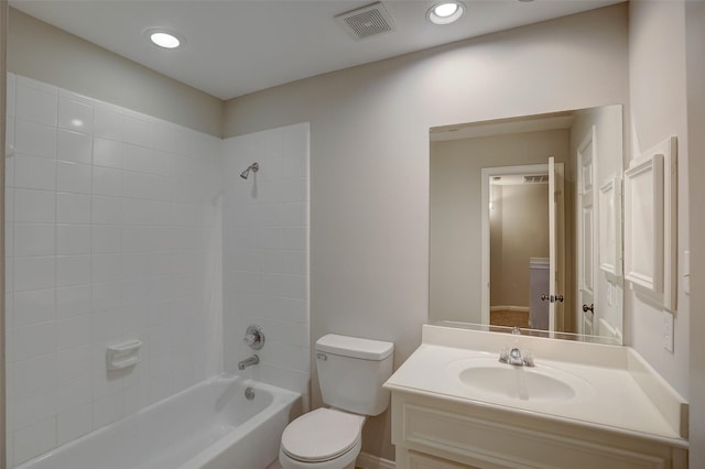 full bathroom featuring toilet, vanity, and tiled shower / bath combo