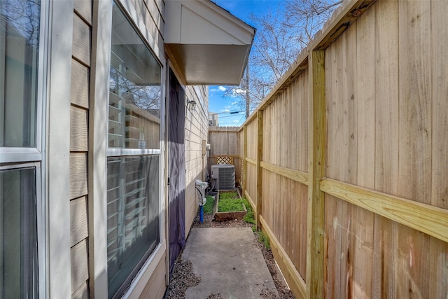 view of side of property featuring central AC