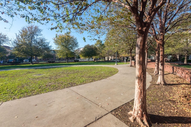 view of property's community featuring a yard