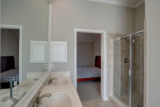 bathroom with vanity, tile patterned floors, a shower with door, and crown molding