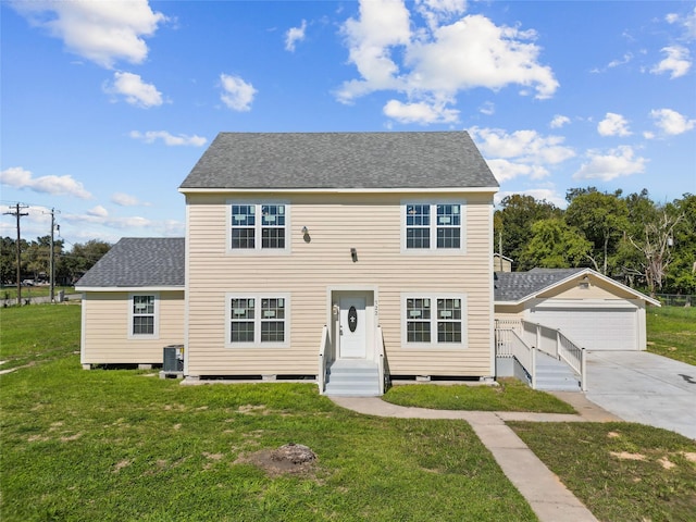 colonial-style house with a garage, central air condition unit, and a front lawn