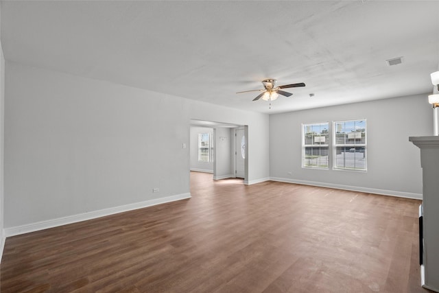 unfurnished living room with hardwood / wood-style flooring and ceiling fan