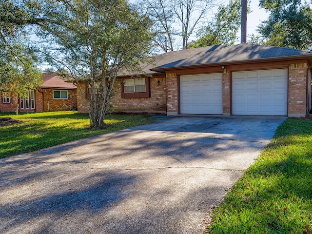 ranch-style home with a garage and a front yard