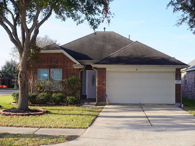 ranch-style house with a garage and a front lawn