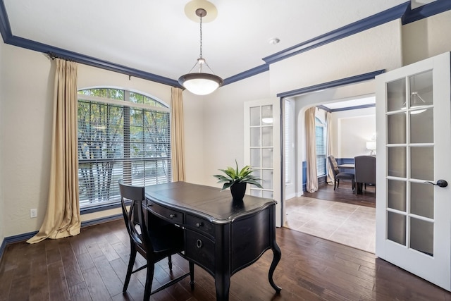 dining room with french doors, dark wood-type flooring, and ornamental molding