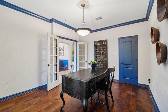 dining area featuring crown molding, french doors, and dark wood-type flooring