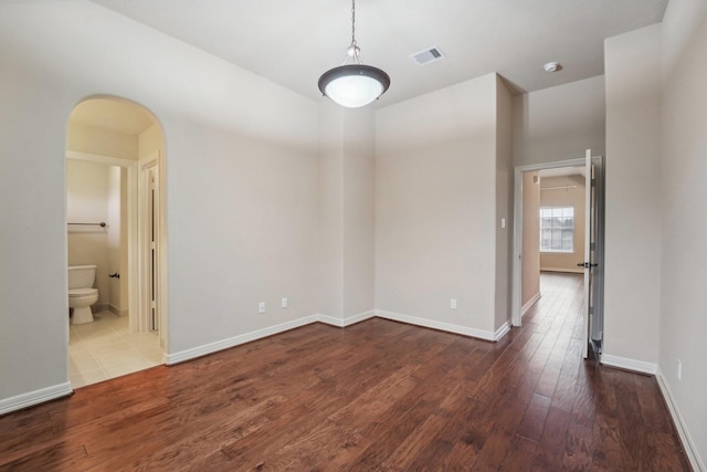 empty room with hardwood / wood-style flooring