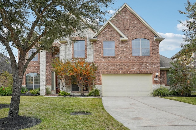 view of front of home with a front lawn and a garage