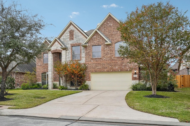 view of front of home with a front yard and a garage