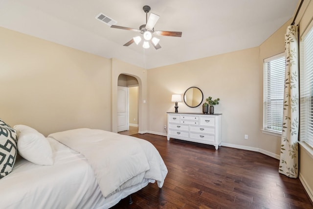 bedroom with ceiling fan and dark hardwood / wood-style flooring