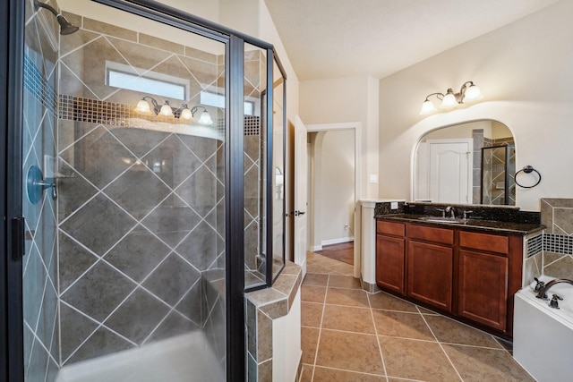 bathroom with tile patterned floors, plus walk in shower, and vanity