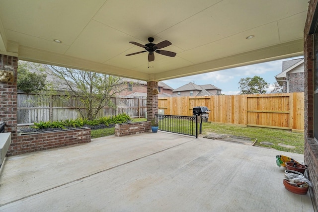 view of patio featuring area for grilling and ceiling fan