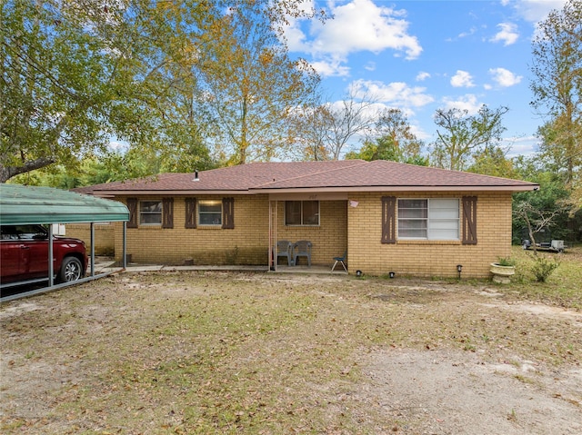 ranch-style home with a carport